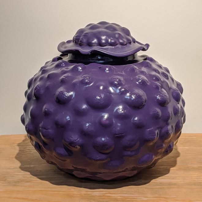 Bumpy, purple lidded jar.