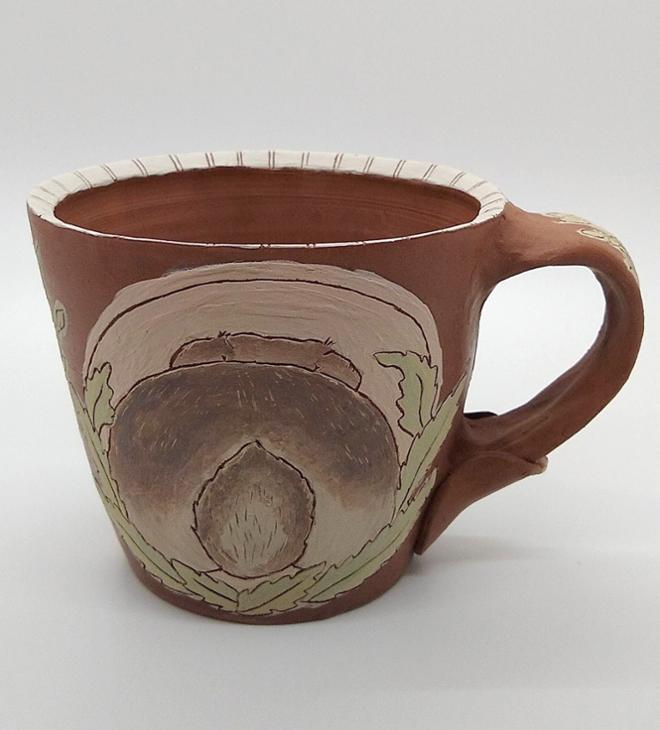 Ceramic mug with backside of rabbit painted.