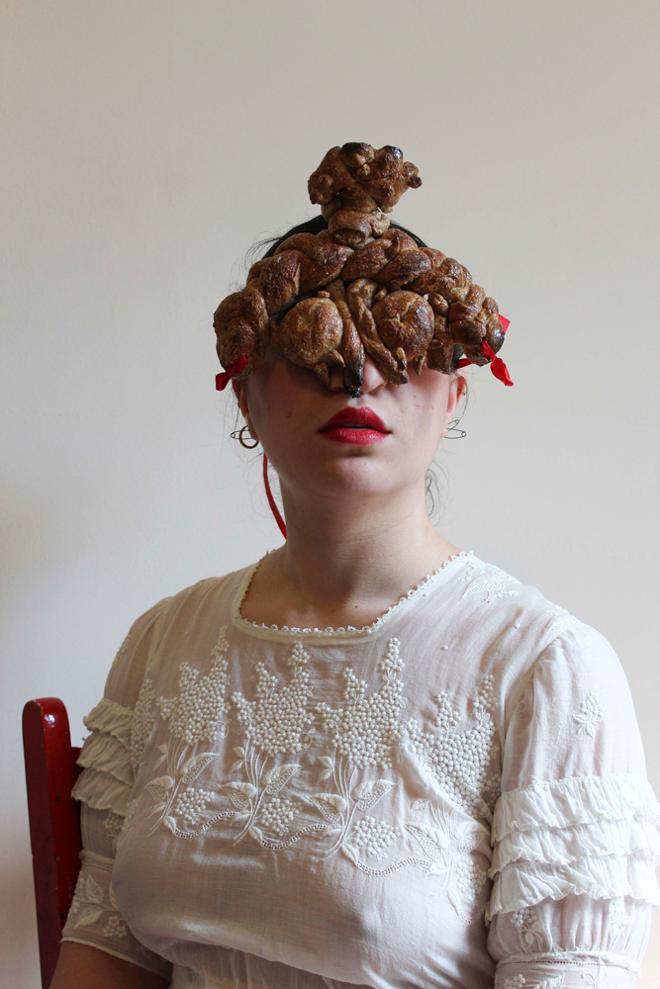 Woman wearing eye mask made of bread.