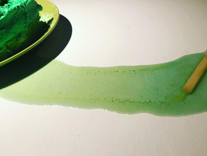 An image of a green melted popsicle.  